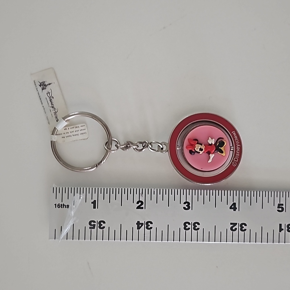 New Walt Disney Minnie Mouse Spinner Keychain featuring a cat design - Picture 3 of 8